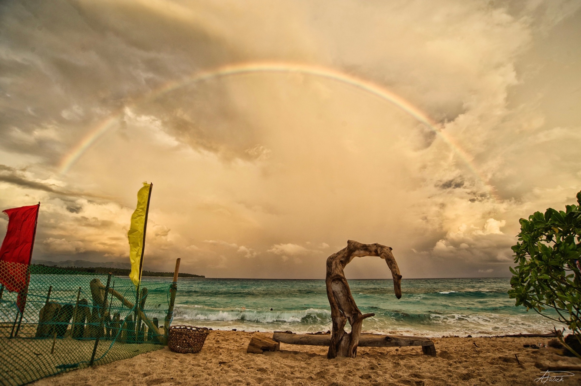 Rainbow over the sea at sunset, Philippines coastline by Alwood Wick
